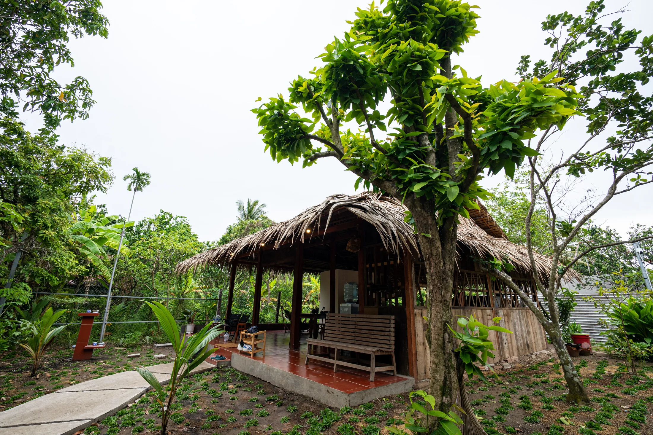 Open thatched common pavilion at Mango Home