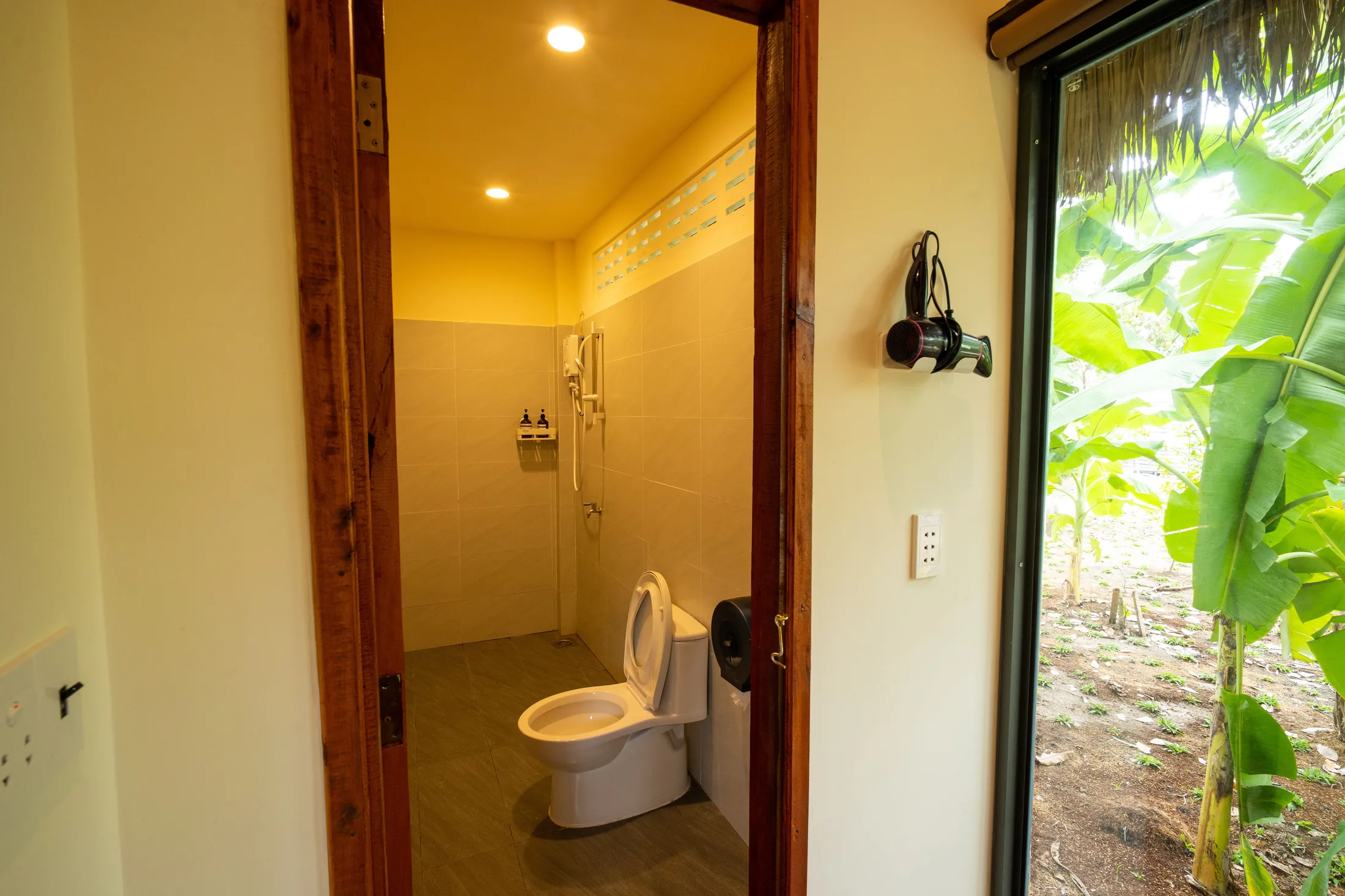 Bathroom and shower in Mango Suite